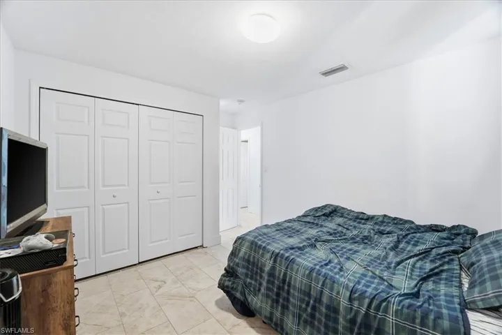 Bedroom featuring a closet