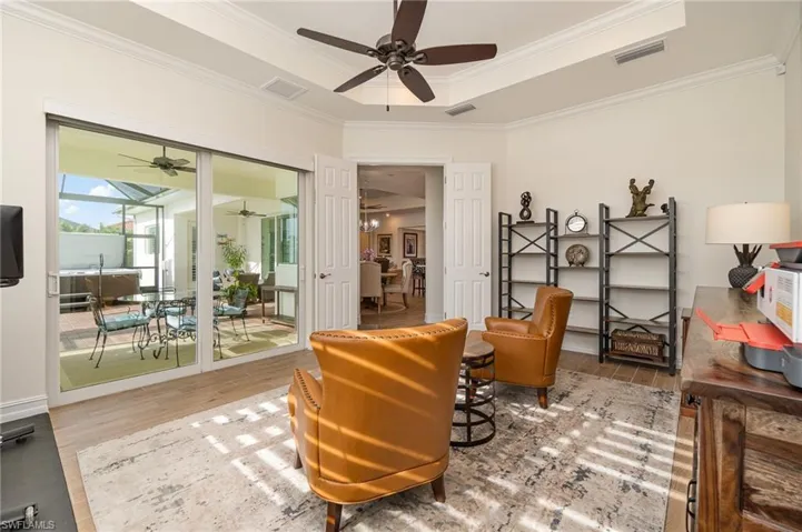 Bonus Room/Study/Den/4th Bedrm area featuring ceiling fan, raised ceiling, tiled flooring, and crown molding