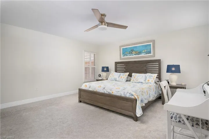 Bedroom with carpet floors and ceiling fan