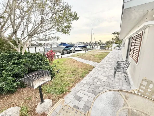 View of green lawn with boat lift