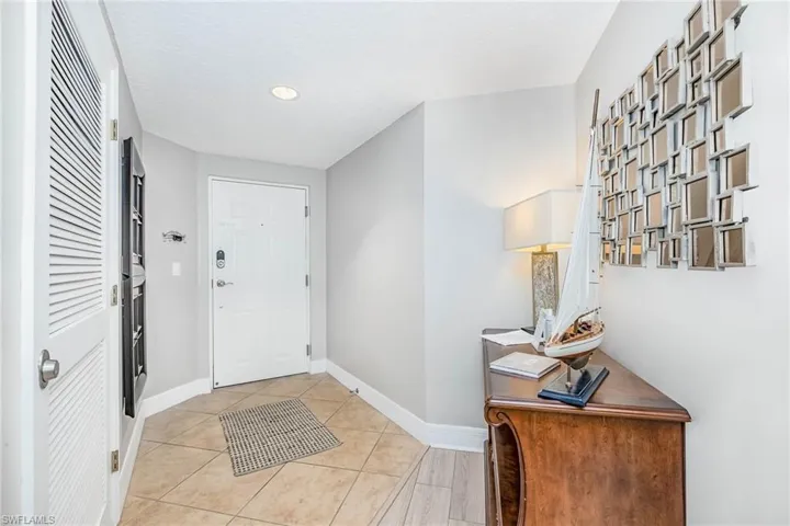 Foyer featuring light tile patterned floors and recessed lighting