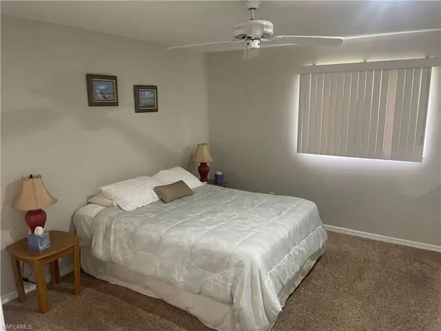 Bedroom with carpet flooring and a ceiling fan
