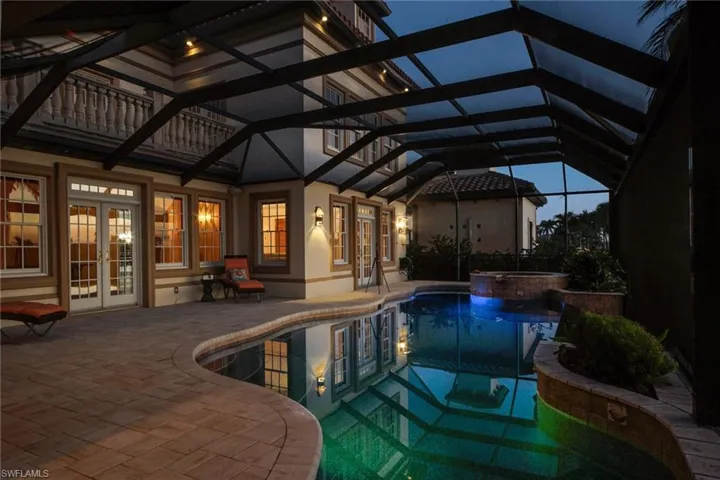 New pavers surround infinity edge pool with colored lights feature
