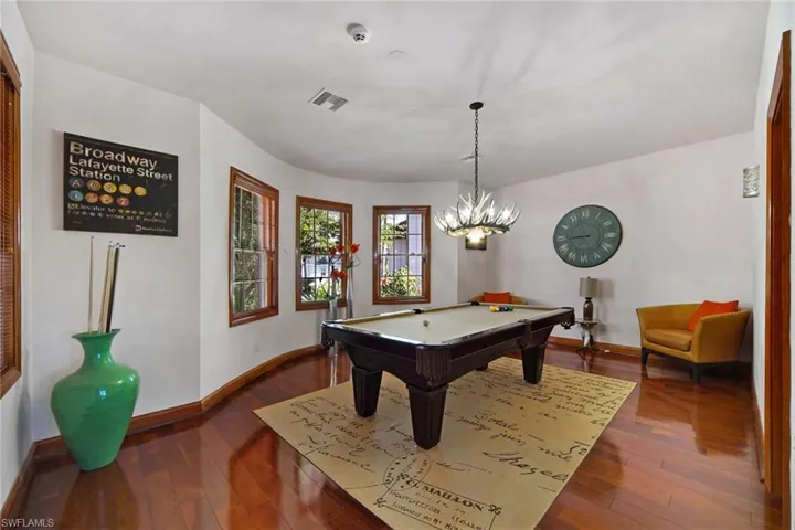 Family/Game room with cherrywood floors and pool table
