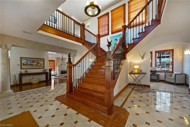 Grand Staircase with ornate columns and a towering ceiling