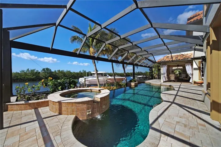 Newly pavered Lanai boasts infinity edge pool and spa with panoramic screens for uninterrupted views