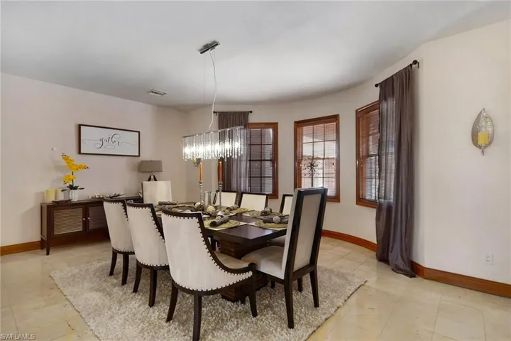 Separate Dining room with noteworthy chandelier.