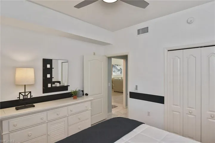 Bedroom featuring a ceiling fan and a closet