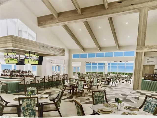 Dining room with vaulted ceiling, tile patterned floors, and recessed lighting
