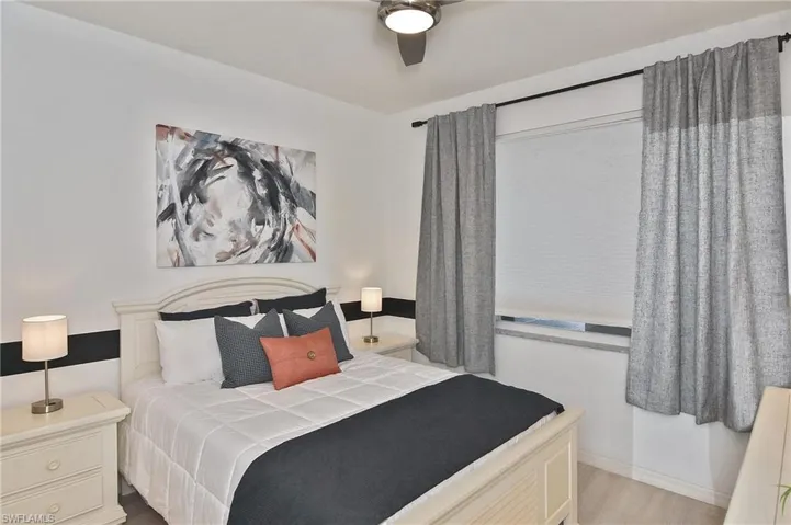 Bedroom featuring a ceiling fan and wood finished floors