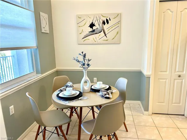 Dining area featuring tile patterned flooring and baseboards