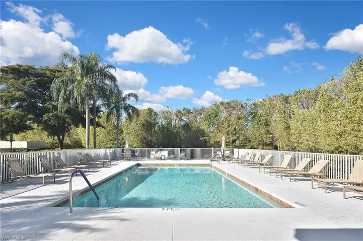 Buildings' community pool with a patio