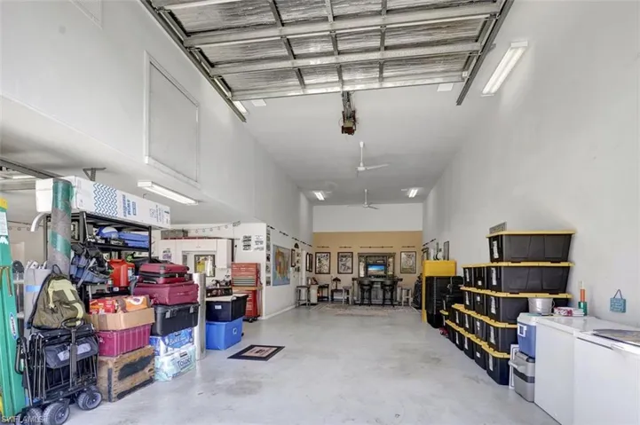 3rd garage bay without RV showing storage ability, room for RV and still room for the bar ALL under AIR
