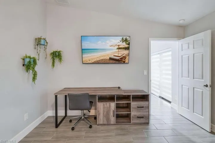 Office with wood tiled floors and baseboards