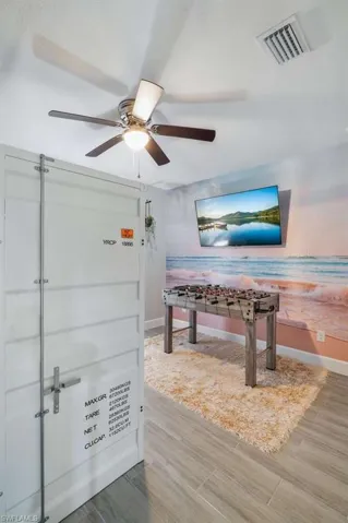 Recreation room with a ceiling fan
