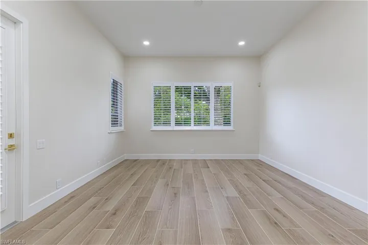 Bedroom featuring light wood-type flooring and recessed lighting
