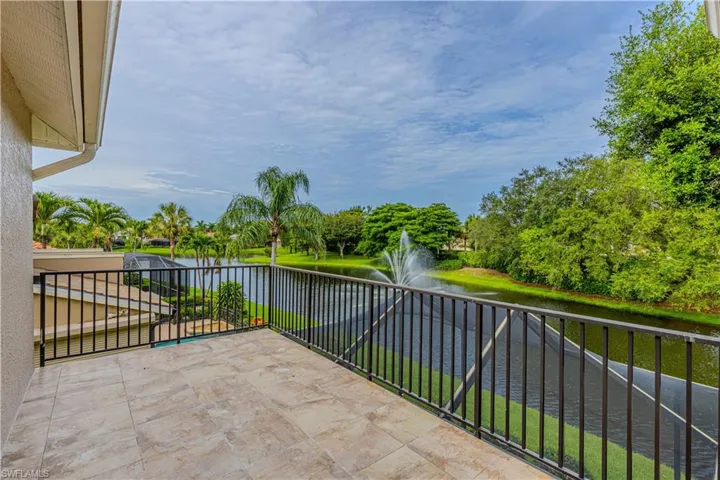 Private second floor balcony featuring beautiful evening sunsets and calming water and fountain view.