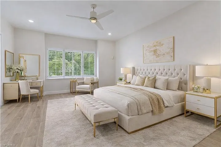 Bedroom featuring wood tiled floors, a ceiling fan, and recessed lighting