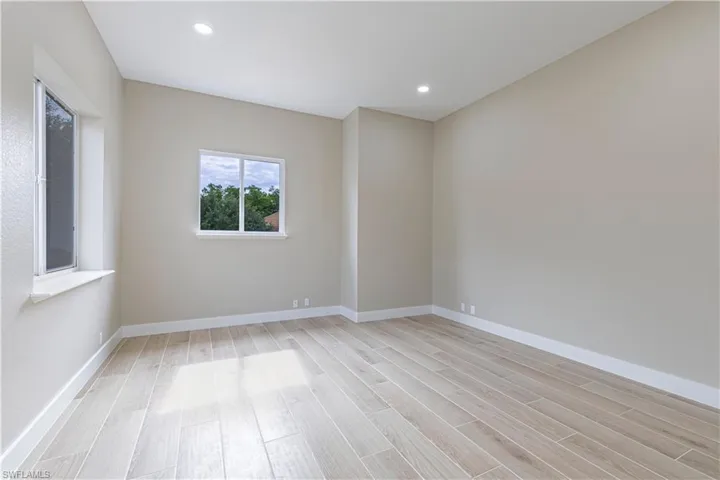 Spare room with light wood-style flooring and recessed lighting