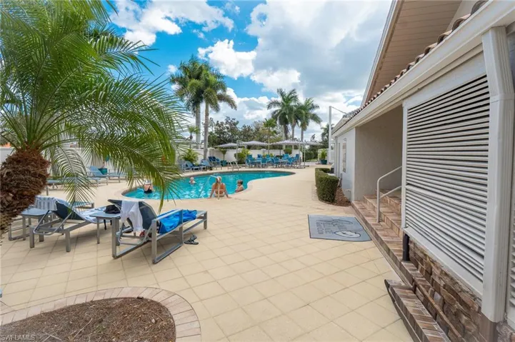 Community pool featuring a patio area