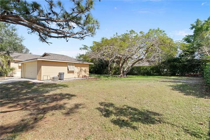View of yard with a garage