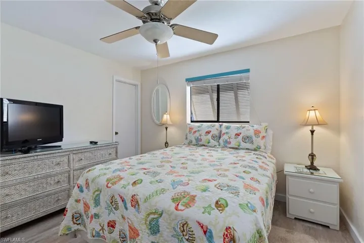 Bedroom featuring ceiling fan and light hardwood / wood-style floors