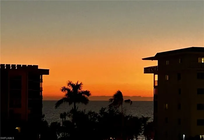 Property view of water at sunset