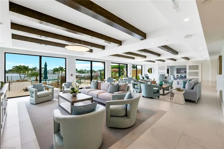 Living room featuring beam ceiling