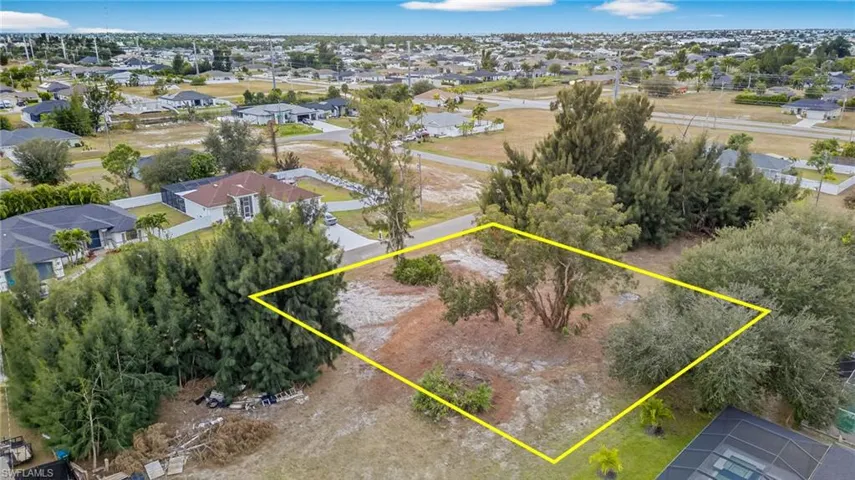 Aerial view of residential area with property boundaries highlighted