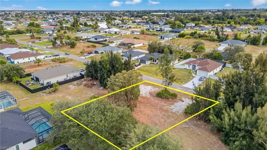 Aerial perspective of suburban area with property boundaries highlighted