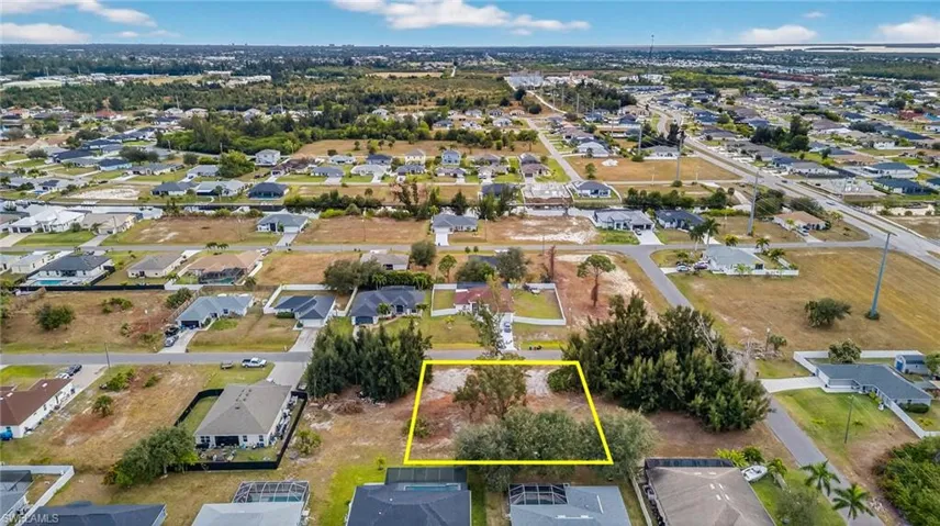 Aerial perspective of suburban area with property boundaries highlighted
