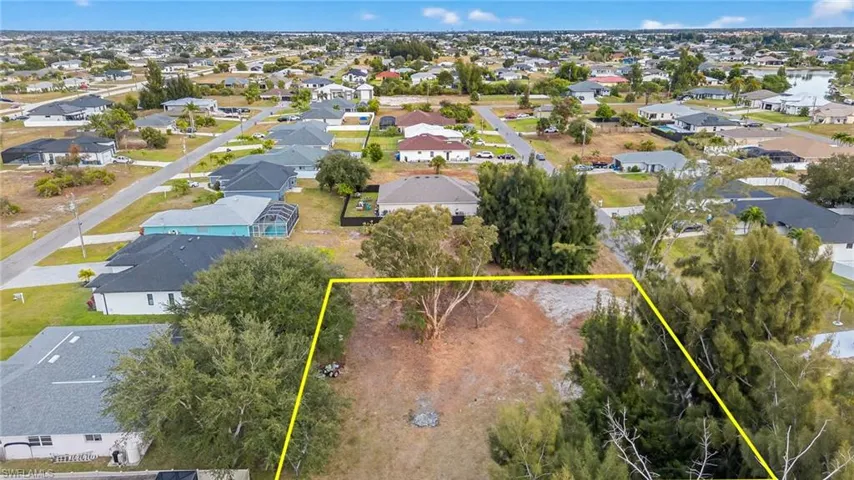 Aerial view of residential area with property boundaries highlighted