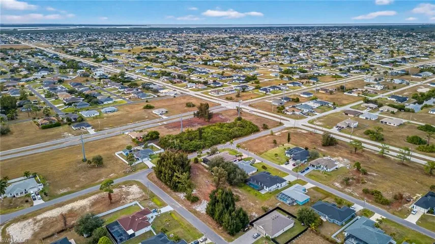 View of property location with nearby suburban area