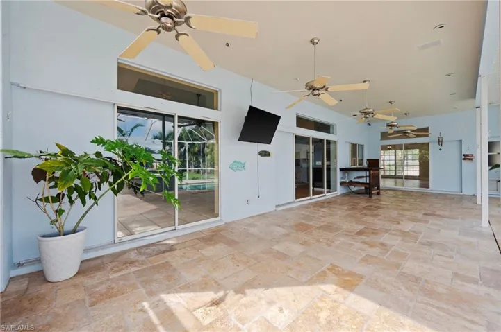 View of patio featuring ceiling fan
