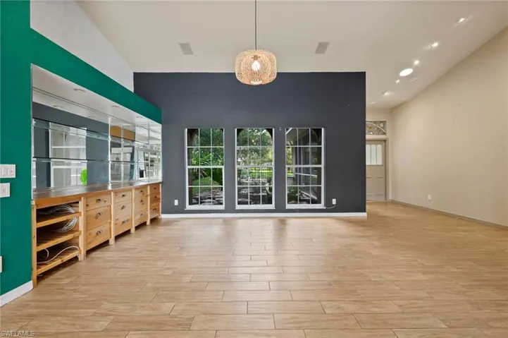Unfurnished living room featuring light wood-style flooring and recessed lighting