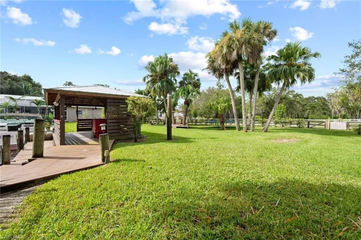 View of grassy yard featuring a gazebo