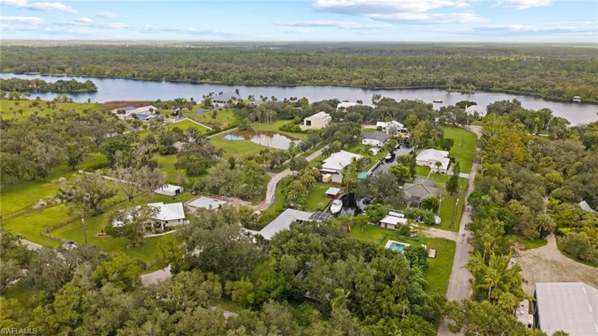 Aerial view of property's location featuring nearby suburban area