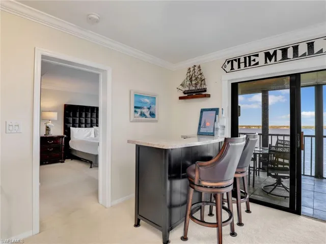 Bar featuring a water view.