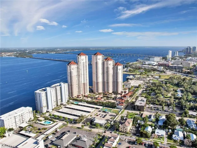 Birds eye view of property with a water view