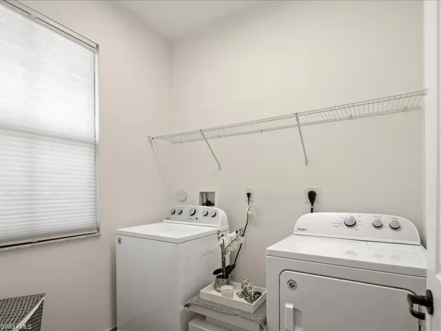 Washroom with washing machine and dryer