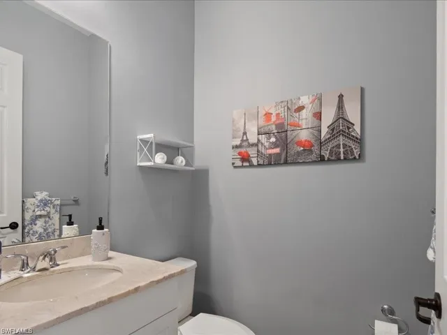 Half bath with vanity and toilet