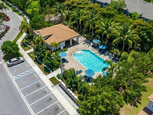 Aerial view of property and surrounding area with a pool