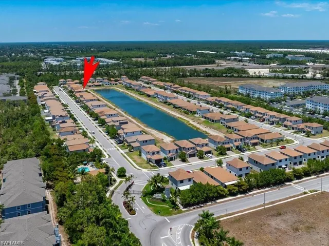 Aerial view of residential area with a large body of water