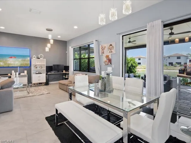 Dining space featuring recessed lighting and light tile patterned floors