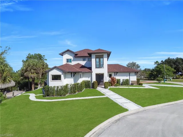 Mediterranean / spanish house featuring a front yard and stucco siding