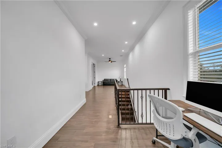 Office featuring crown molding, recessed lighting, wood finish floors, and a ceiling fan