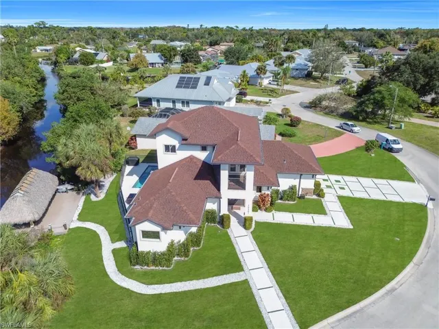 Aerial perspective of suburban area featuring a tree filled landscape