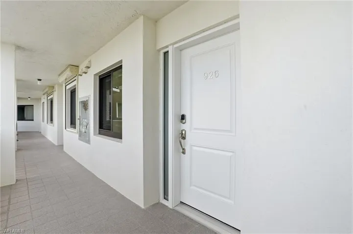 Doorway to property with stucco siding & new door - Virtually Edited Image