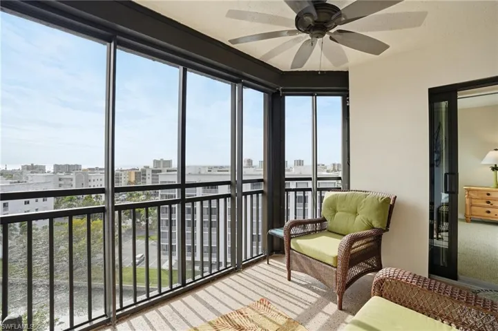 Screened in balcony with a view of canal with Boat Docks - Virtually Edited Image