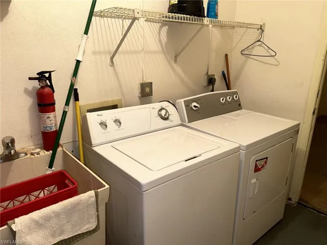 Laundry area with hookup for a washing machine, sink, washer and dryer, and hookup for an electric dryer